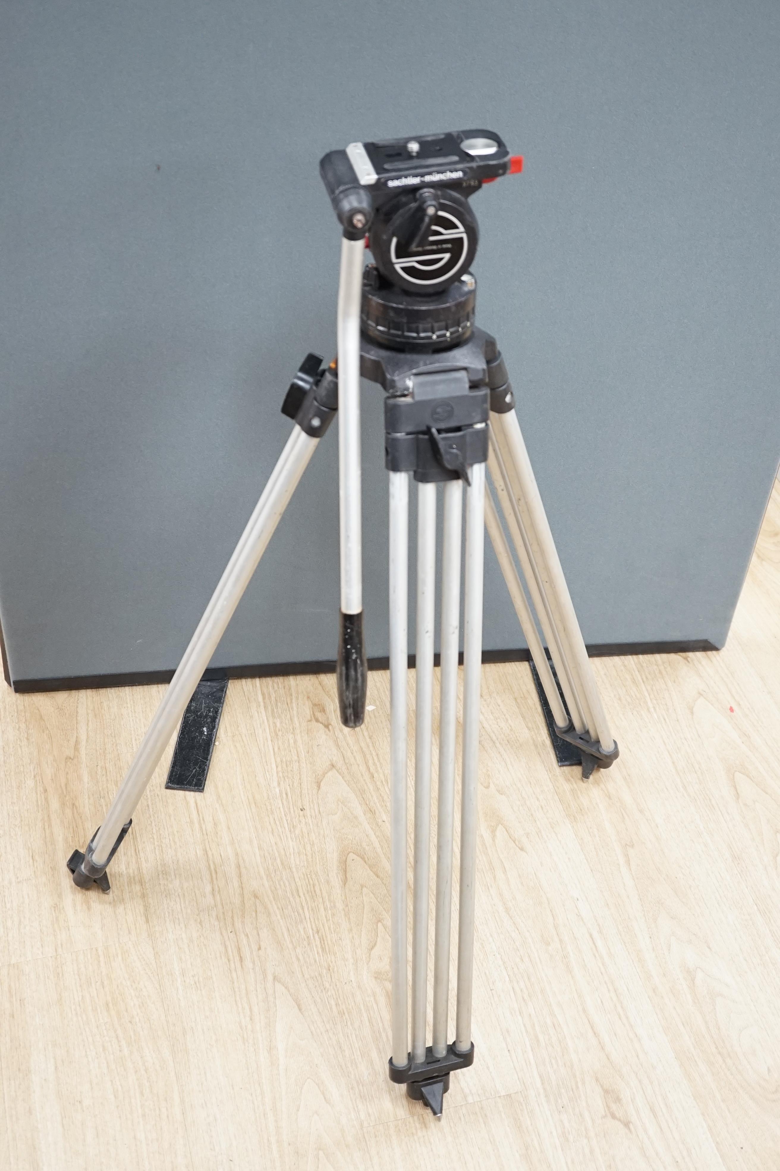 A Sachtler pro broadcast and cine camera, tripod and head, in plastic flight tube, 104cm high